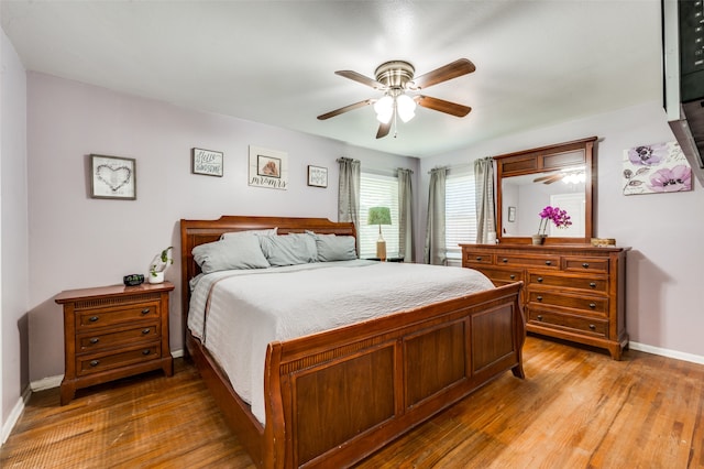 bedroom featuring hardwood / wood-style floors and ceiling fan