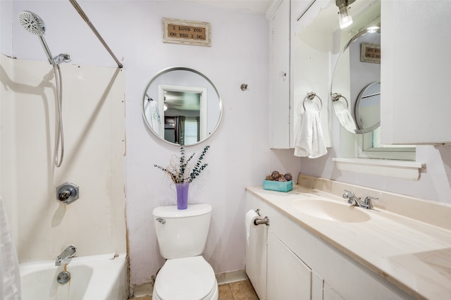 full bathroom featuring vanity, toilet, tile patterned flooring, and washtub / shower combination