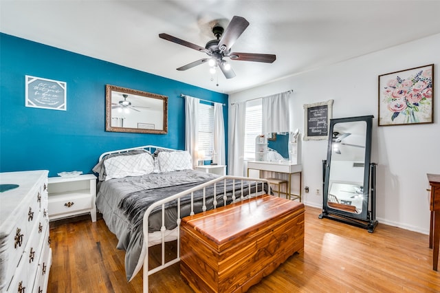 bedroom featuring hardwood / wood-style flooring and ceiling fan