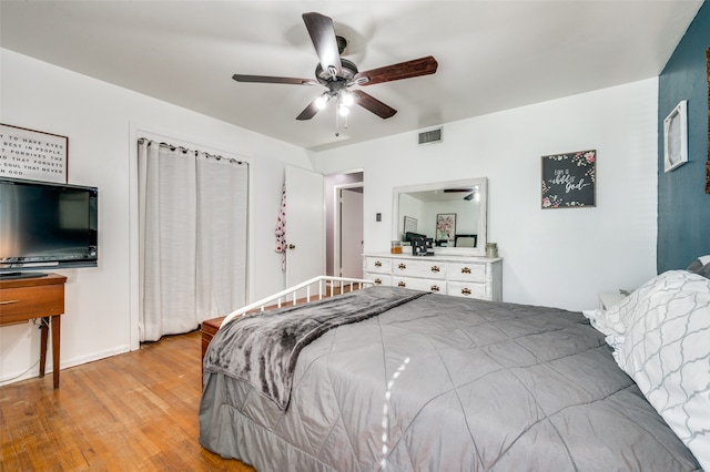 bedroom with light wood-type flooring and ceiling fan