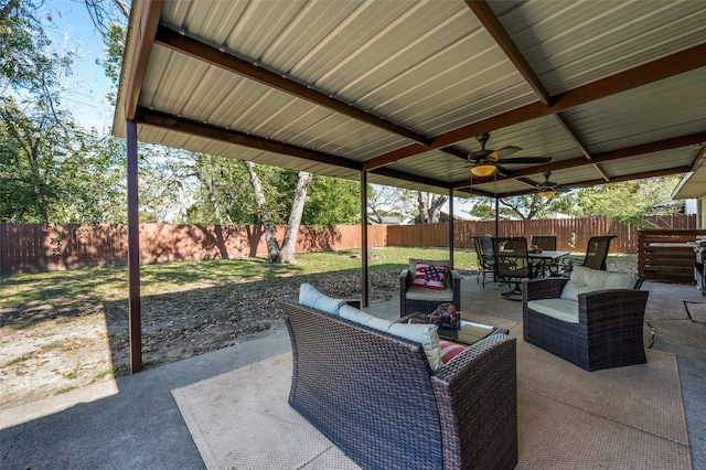 view of patio / terrace with ceiling fan and an outdoor living space