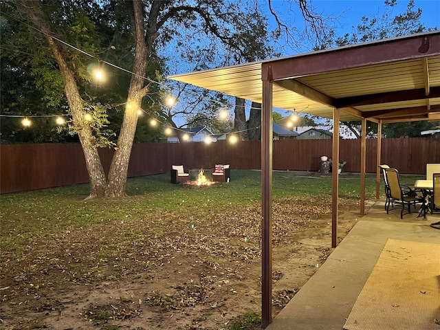 view of yard featuring a fire pit and a patio area