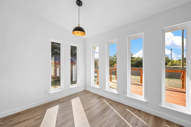 unfurnished sunroom with a healthy amount of sunlight