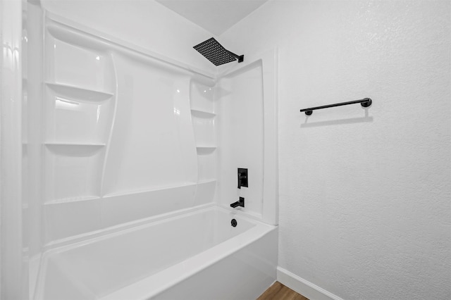 bathroom with shower / bath combination and wood-type flooring