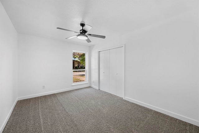 unfurnished bedroom featuring ceiling fan, carpet floors, and a closet