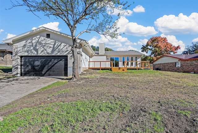 exterior space featuring a garage and a deck