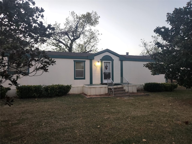 manufactured / mobile home with a front lawn