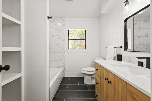 full bathroom with tile patterned floors, vanity, toilet, and tiled shower / bath combo