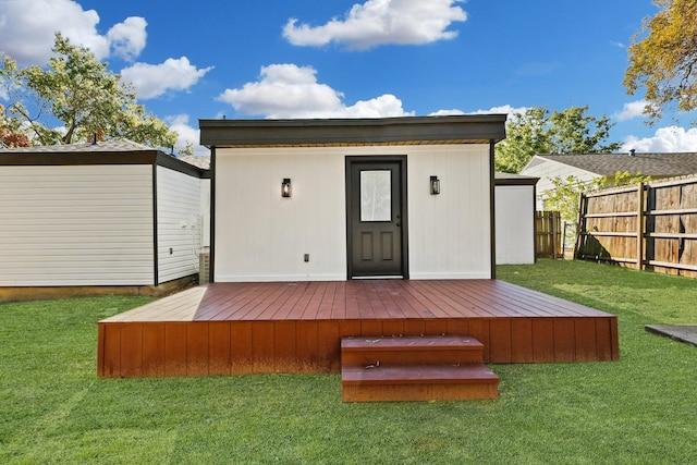 view of outbuilding with a lawn