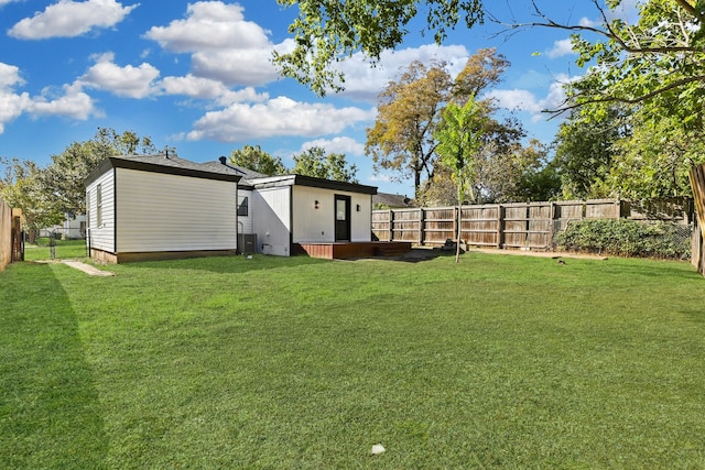 view of yard with a storage unit and central AC