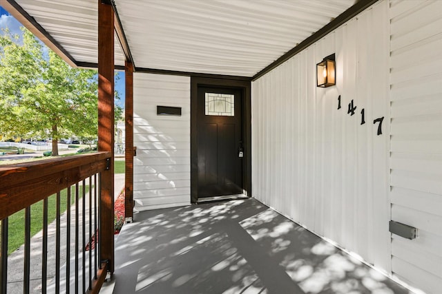 property entrance with covered porch