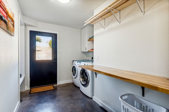 laundry room featuring cabinets and independent washer and dryer