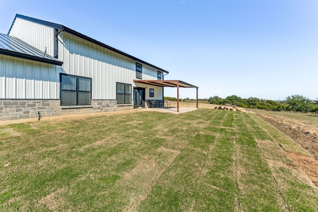 exterior space featuring a lawn and a patio