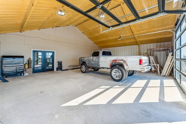 garage featuring french doors and a carport