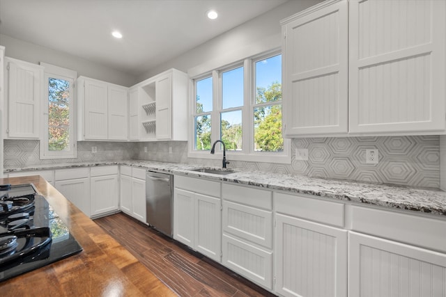 kitchen with sink, white cabinets, dishwasher, tasteful backsplash, and dark wood-type flooring