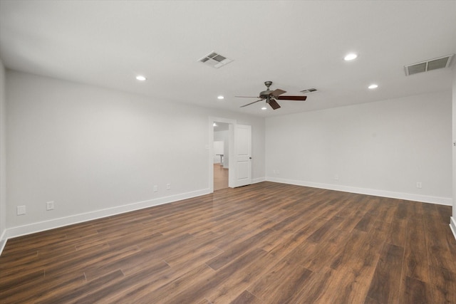 empty room featuring ceiling fan and dark wood-type flooring