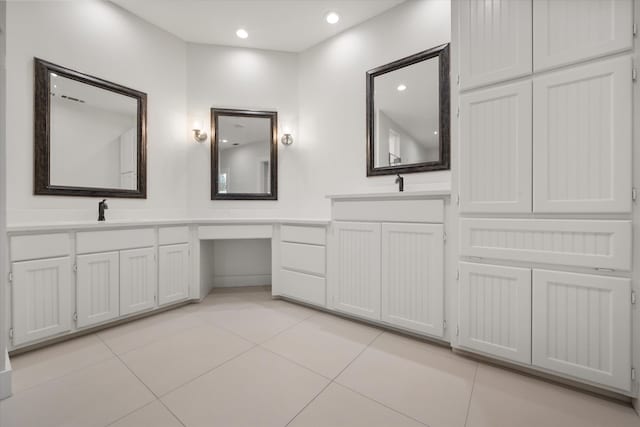 bathroom with tile patterned flooring and vanity