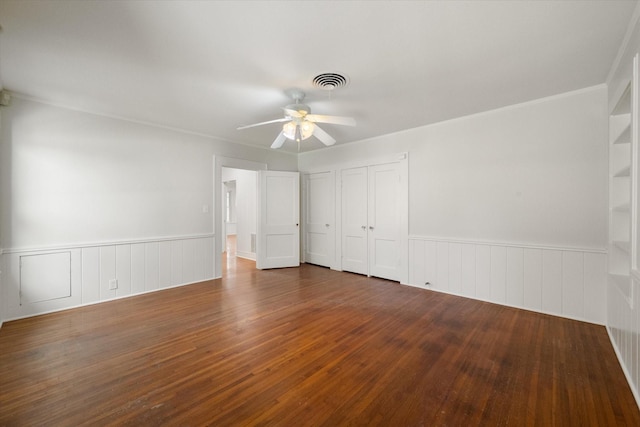 unfurnished bedroom with dark wood-type flooring and ceiling fan