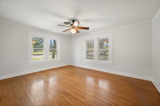 unfurnished room with hardwood / wood-style flooring, ceiling fan, and crown molding