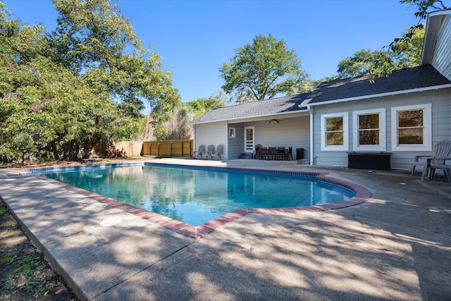 view of pool with ceiling fan and a patio area