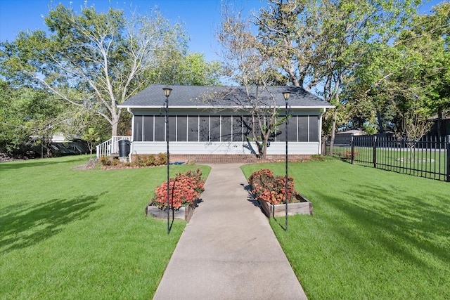 view of yard with a sunroom