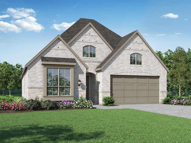 view of front of house featuring a front yard and a garage