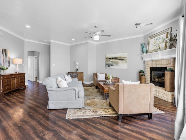 840 Bentwater Pkwy, Grand Prairie, TX 75104 - living area with arched walkways, a ceiling fan, recessed lighting, wood finished floors, and a brick fireplace
