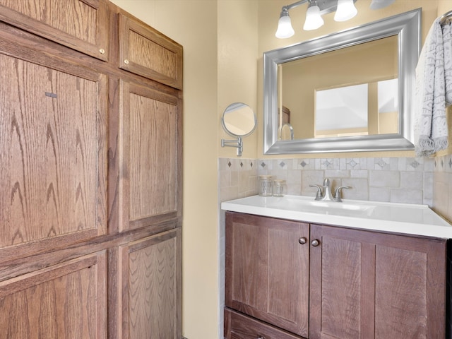 bathroom featuring decorative backsplash and vanity