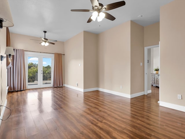 unfurnished living room with ceiling fan, dark wood-type flooring, and french doors