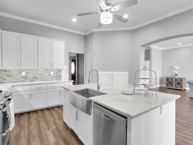 kitchen with a kitchen island with sink, white cabinetry, sink, and appliances with stainless steel finishes