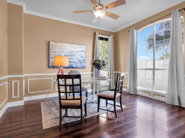 dining space featuring crown molding, dark wood-type flooring, ceiling fan, and a healthy amount of sunlight