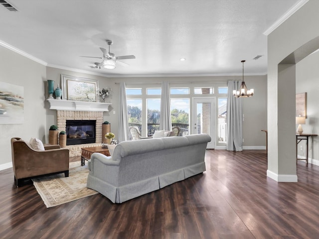 840 Bentwater Pkwy, Grand Prairie, TX 75104 - living room with crown molding, ceiling fan, baseboards, a chandelier, and dark wood-style floors