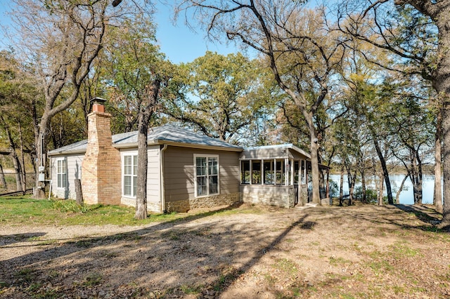 exterior space featuring a sunroom