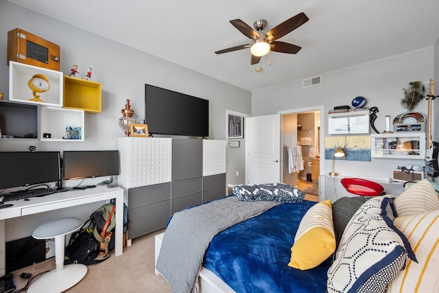 bedroom featuring connected bathroom, light carpet, and ceiling fan