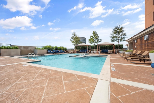 view of pool featuring a gazebo and a patio area