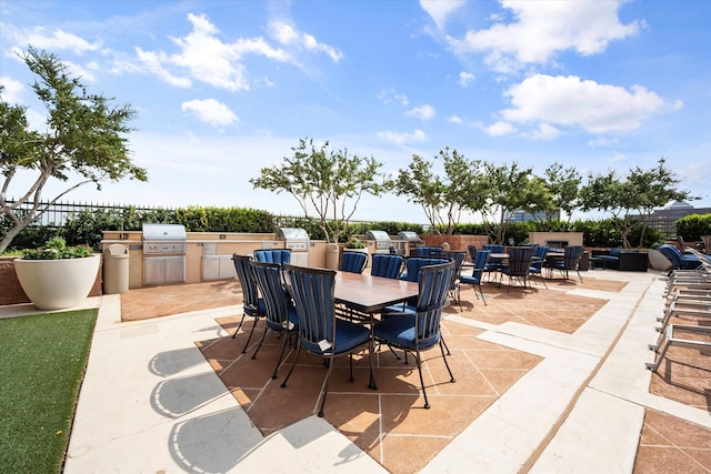 view of patio / terrace featuring a grill and exterior kitchen