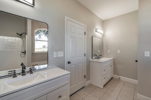 bathroom featuring tile patterned floors, a shower, and vanity