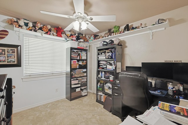 office space with ceiling fan and light tile patterned floors