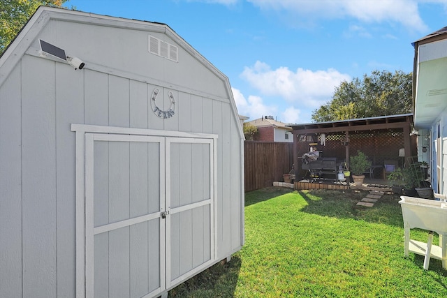 view of outdoor structure with a lawn