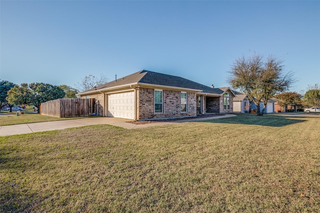 ranch-style home with a garage and a front lawn