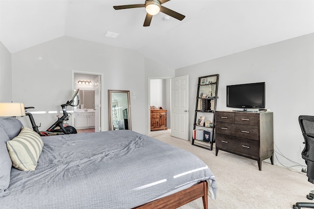 carpeted bedroom featuring connected bathroom, ceiling fan, and vaulted ceiling