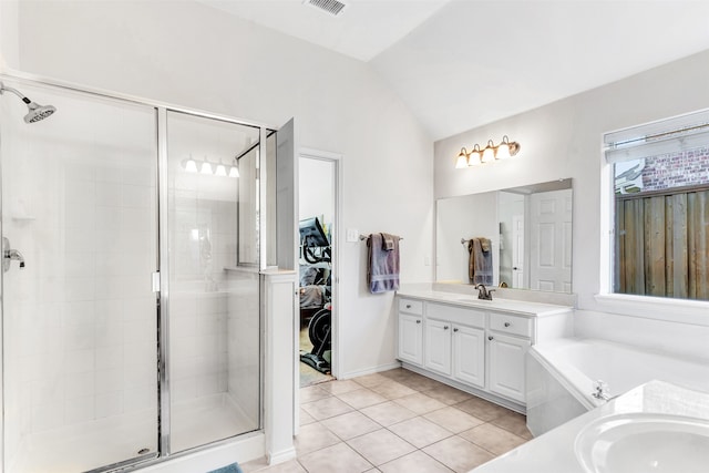 bathroom featuring tile patterned flooring, vanity, vaulted ceiling, and independent shower and bath