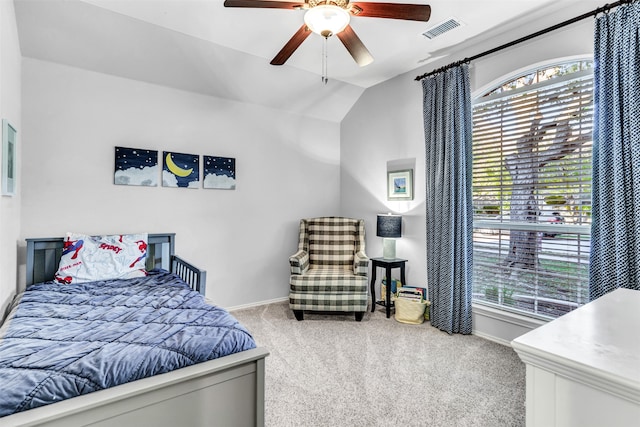 carpeted bedroom with ceiling fan and lofted ceiling