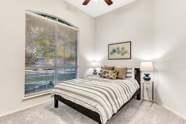 bedroom with light carpet and ceiling fan