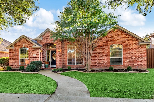 front facade with a front lawn