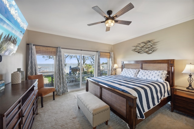 carpeted bedroom featuring ceiling fan, access to exterior, and ornamental molding