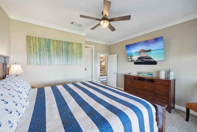 carpeted bedroom with ceiling fan and crown molding