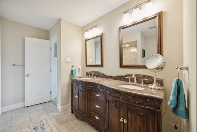 bathroom with tile patterned flooring and vanity