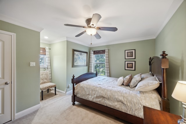 bedroom with ceiling fan, crown molding, and light colored carpet