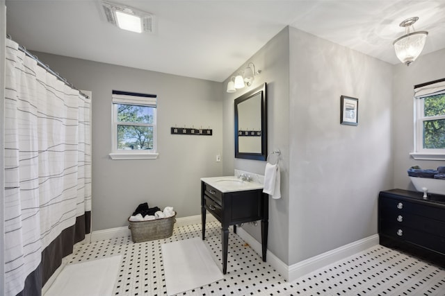 bathroom with vanity and a shower with shower curtain